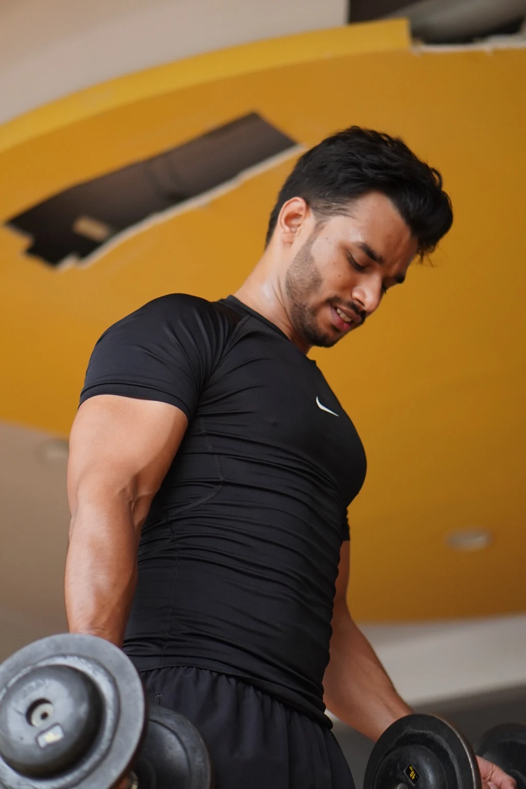 Rahul Manhar training with dumbbells